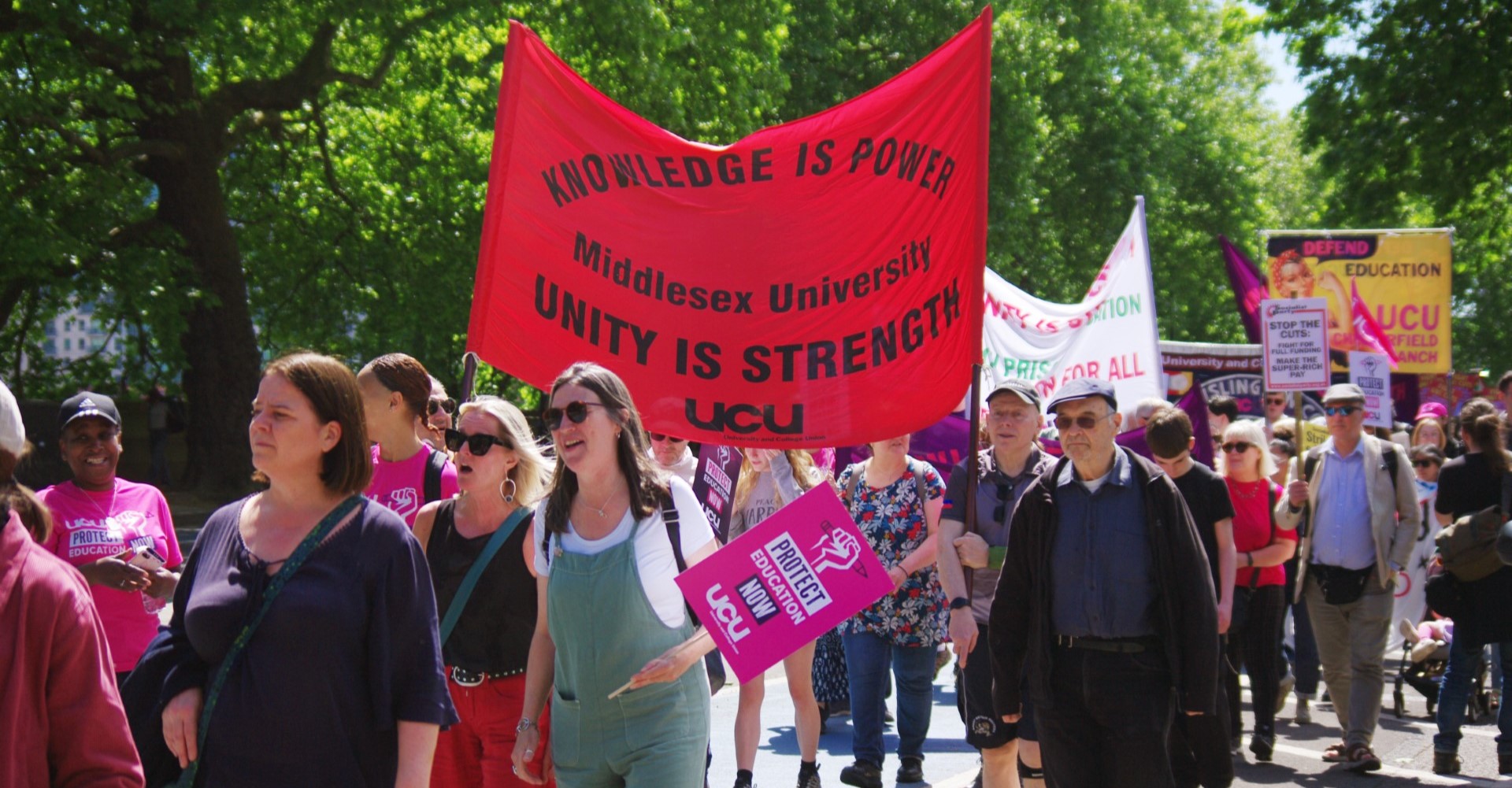 UCU members at a rally in London, with signs and banners such as "Protect education now" and "Unity is Strength"